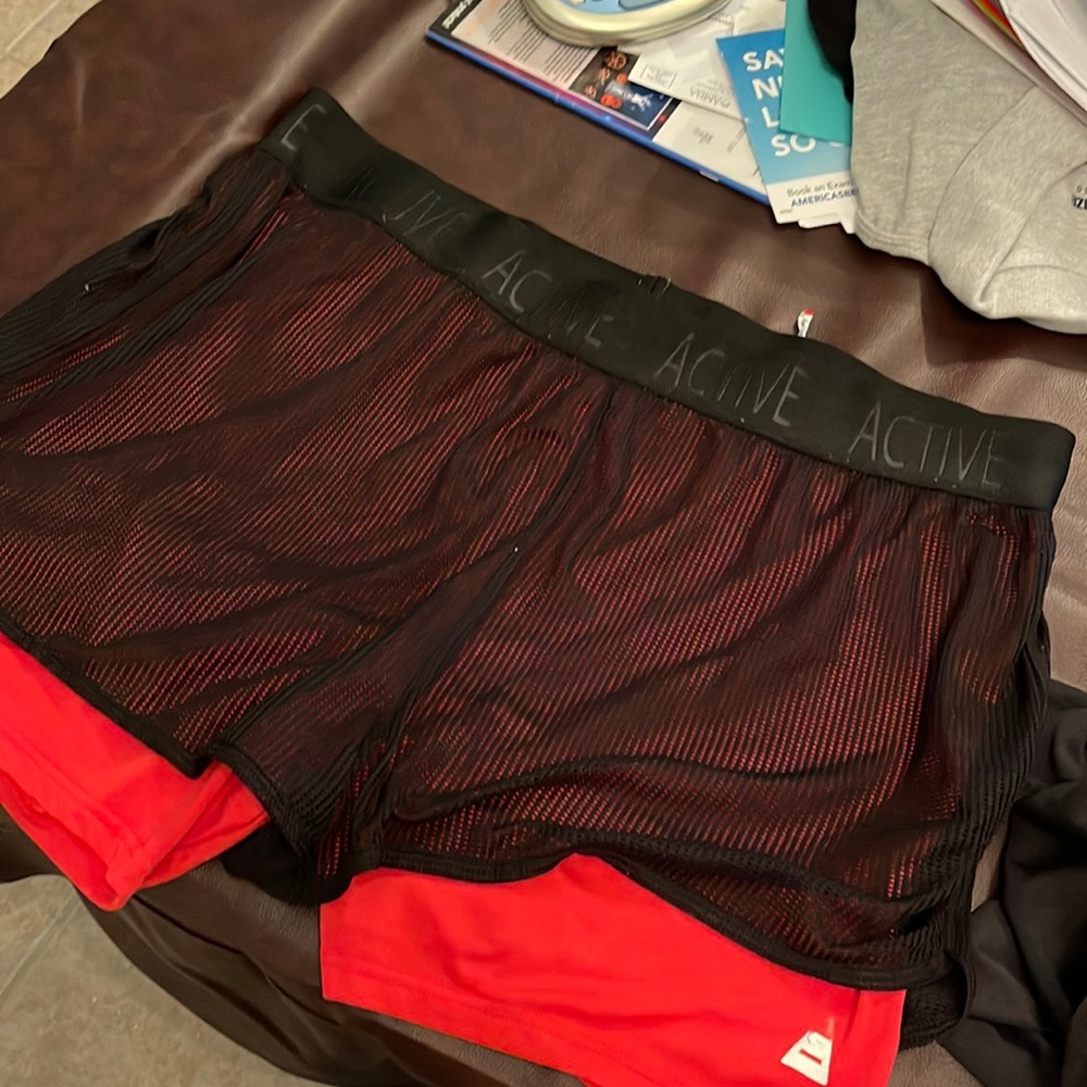 Black netting running shorts with red lining